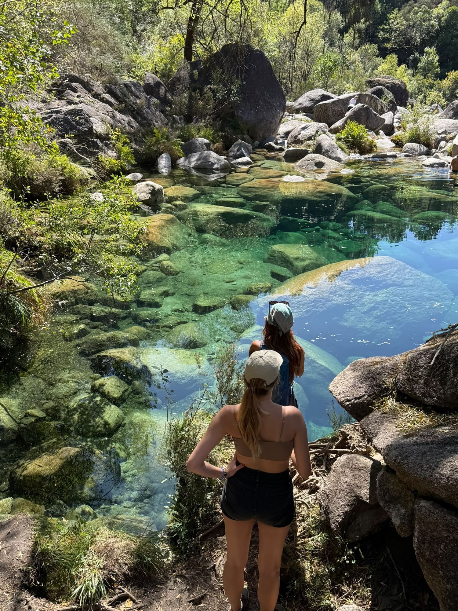 Residents at a clear river pool in Peneda-Gerês National Park